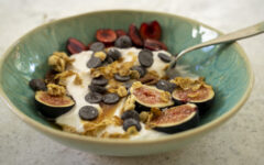 Yogurt Bowl with fruit, granola, chocolate chips, honey, and kosher salt